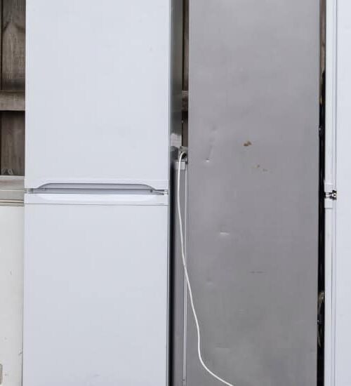 Old refrigerators and appliances lined up outside