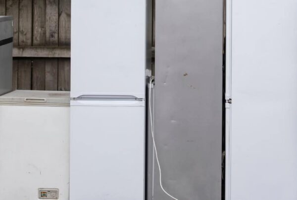 Old refrigerators and appliances lined up outside